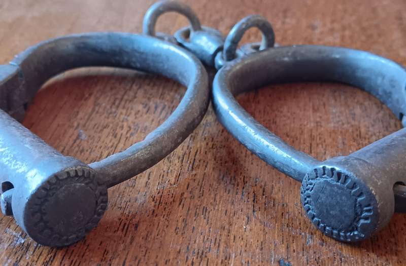 Victorian Hiatt iron handcuffs with key - working