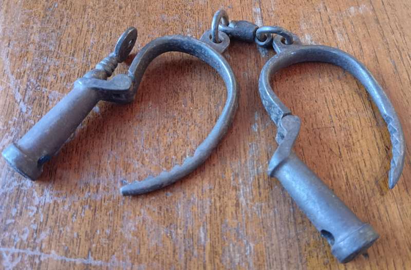 Victorian Hiatt iron handcuffs with key - working