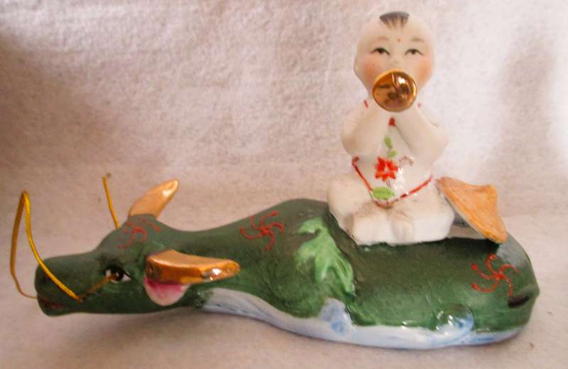 SALE R25 - Two Cute Ceramic Chinese Musical Babies on lying cows Figurenes. 170x100mm