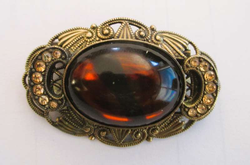Vintage Oval Brooch with Bronze color Filigree and Rhinestones, with Amber color Stone Centre. 50mm.