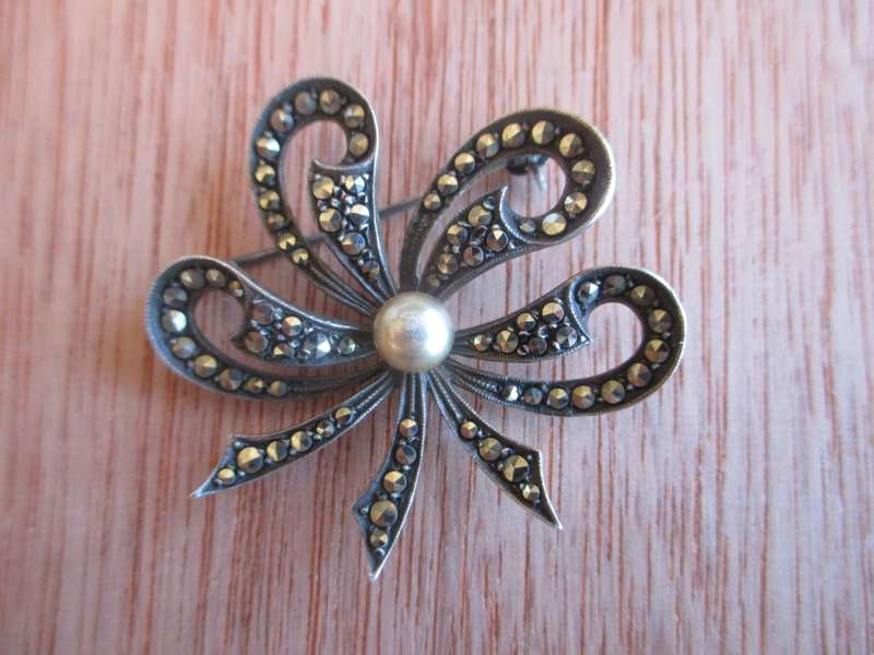 Vintage Marcasite Silver Bow W/ Faux Pearl. Lovely classy item.