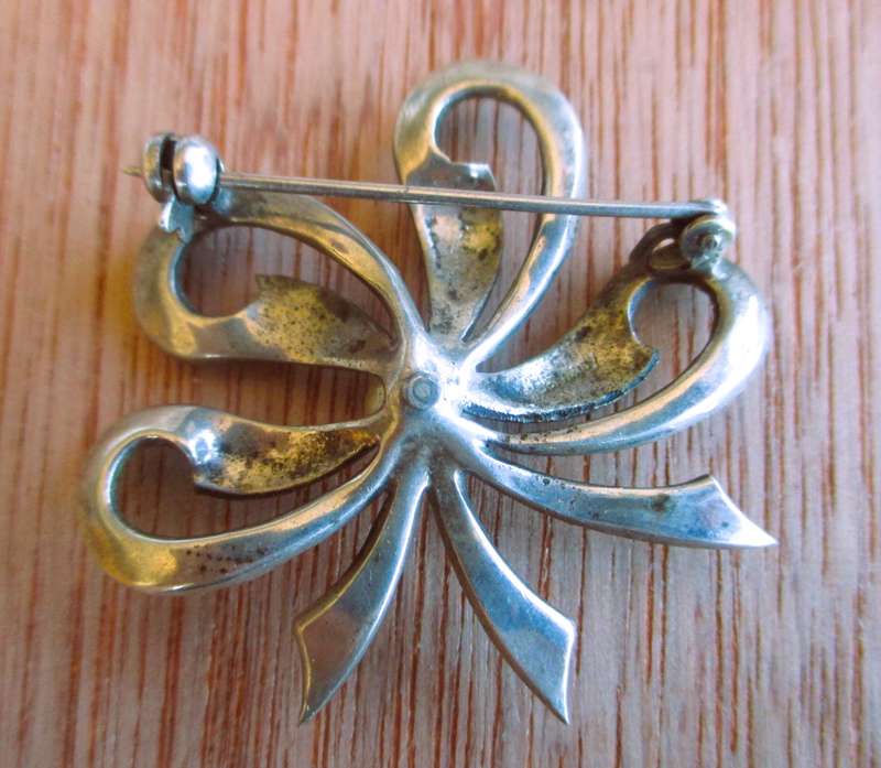 Vintage Marcasite Silver Bow W/ Faux Pearl. Lovely classy item.