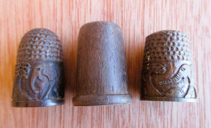 Lot of three wooden thimbles, 2 with elephants carved, different sizes.