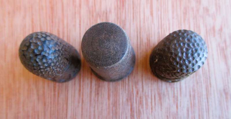 Lot of three wooden thimbles, 2 with elephants carved, different sizes.