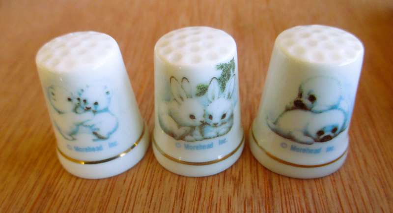 Set of  White Porcelain Thimbles - Arctic Animals. Morehead Inc.