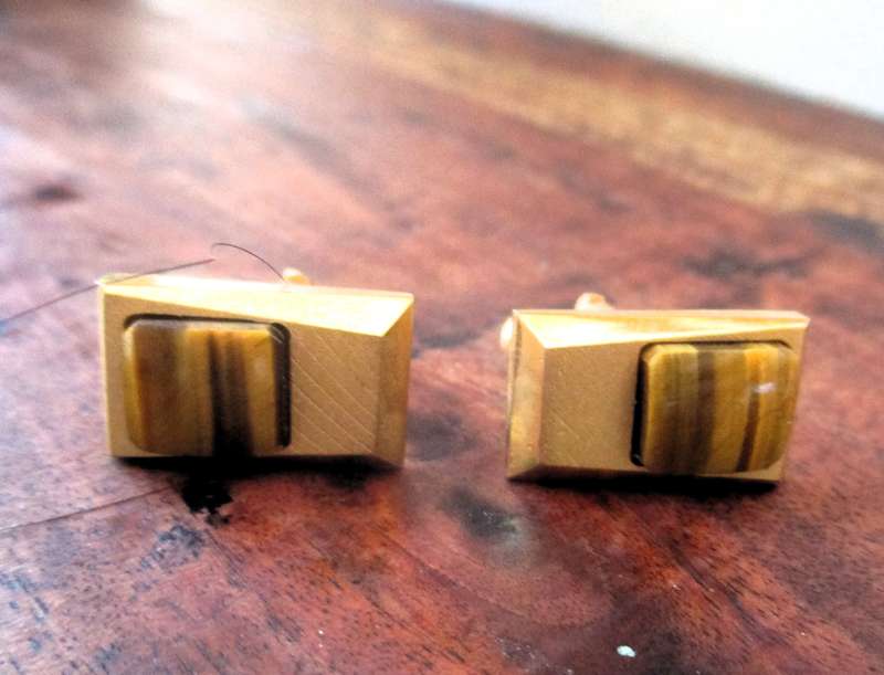 Vintage gold color cufflinks with tiger eye detail.