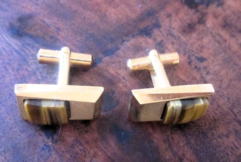 Vintage gold color cufflinks with tiger eye detail.