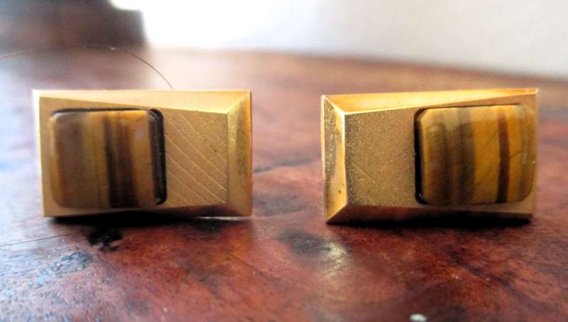 Vintage gold color cufflinks with tiger eye detail.