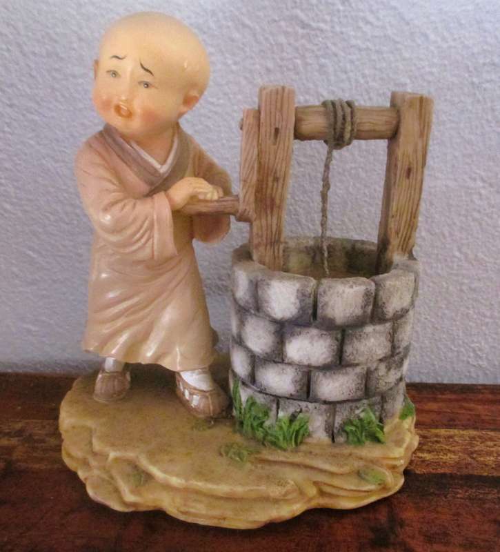 Vintage Shaolin Baby Monk Resin Figurene getting water from a well. Very Collectable. 130x120mm