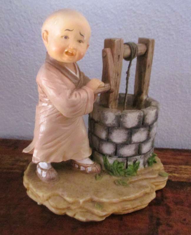 Vintage Shaolin Baby Monk Resin Figurene getting water from a well. Very Collectable. 130x120mm