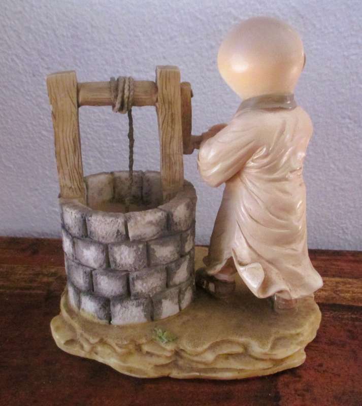 Vintage Shaolin Baby Monk Resin Figurene getting water from a well. Very Collectable. 130x120mm
