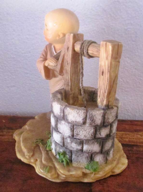 Vintage Shaolin Baby Monk Resin Figurene getting water from a well. Very Collectable. 130x120mm