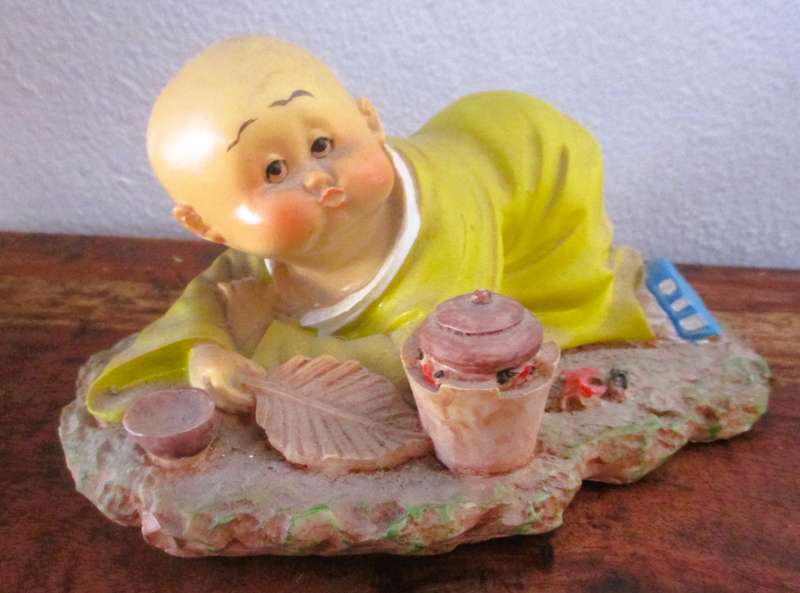 Vintage Shaolin Baby Monk Resin Figurene making a fire. Very Collectable. 140x100mm