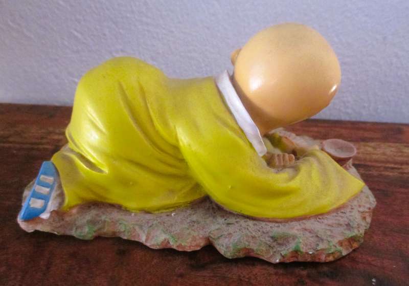 Vintage Shaolin Baby Monk Resin Figurene making a fire. Very Collectable. 140x100mm