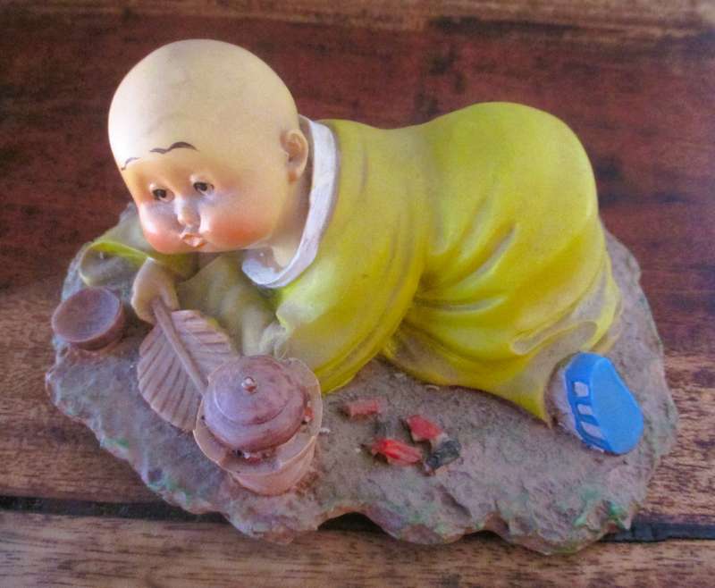 Vintage Shaolin Baby Monk Resin Figurene making a fire. Very Collectable. 140x100mm