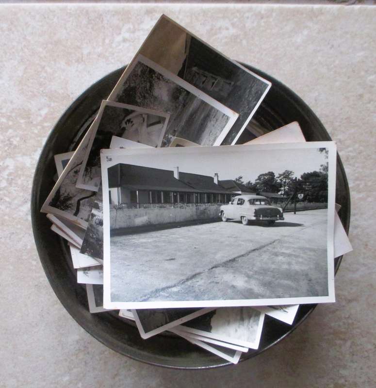 Vintage enmark Cookie Tin withlots of balck and white photos.
