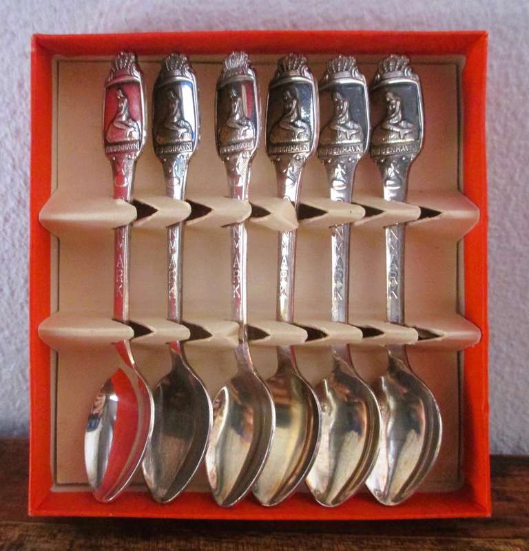 6 small Greetings from Denmark Silverplate Spoons in box.