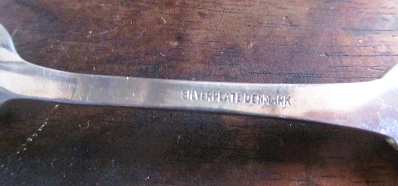 6 small Greetings from Denmark Silverplate Spoons in box.