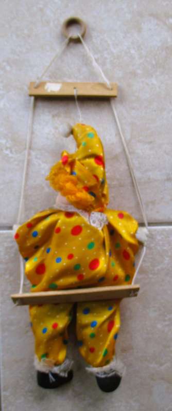 Vintage Hanging Porcelain Face Clown Doll with Yellow Hair, clothes on a swing. Doll 400mm long