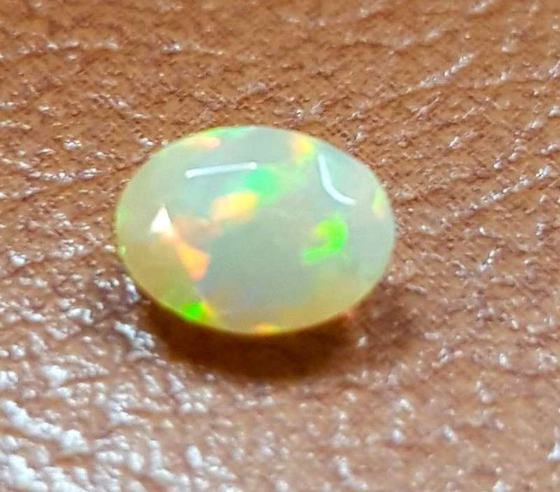 Opal 0.52Cts Oval Facetted 5x7mm Multi Colours Glittering Rainbow 3D! Ethiopian Natural