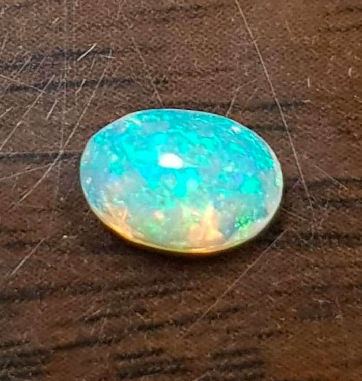 Opal 0.68Cts Oval Facetted 5x7mm Multi Colours Glittering Rainbow 3D! Ethiopian Natural