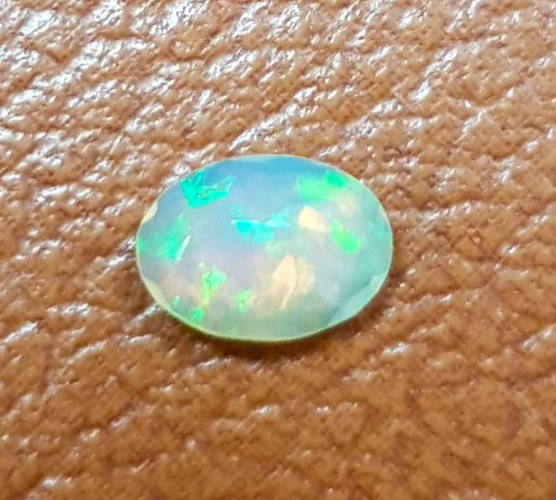 Opal 0.54Cts Oval Facetted 5x7mm Multi Colours Glittering Rainbow 3D! Ethiopian Natural
