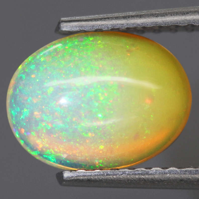 1.04Ct.  Opal Oval Cabochon Multi Colors Glittering Rainbow 3D! Ethiopian Natural