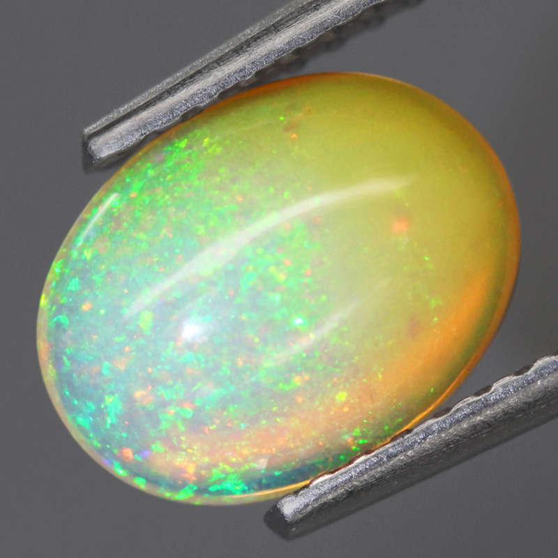 1.04Ct.  Opal Oval Cabochon Multi Colors Glittering Rainbow 3D! Ethiopian Natural