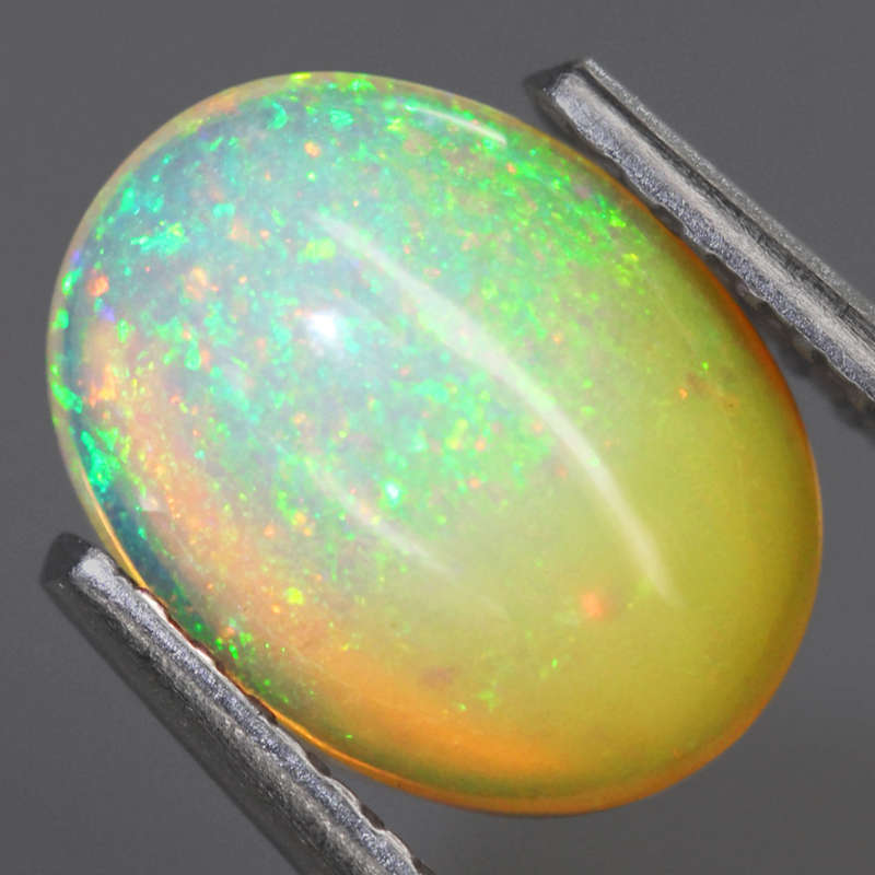 1.04Ct.  Opal Oval Cabochon Multi Colors Glittering Rainbow 3D! Ethiopian Natural