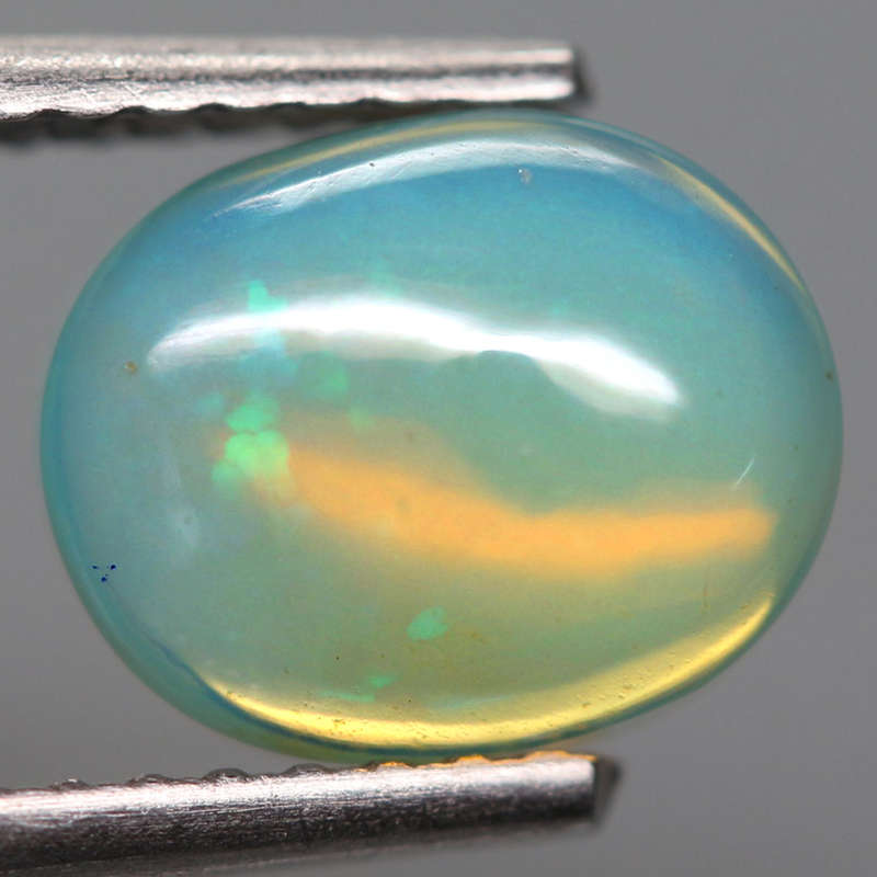 1.12Ct. Opal Oval Cabochon Multi Colors Glittering Rainbow 3D Ethiopian Gemstone