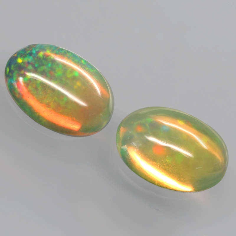 0.96Ct.  Opal Oval **Pair**Cabochon Multi Colors Glittering Rainbow 3D Ethiopian Gemstone