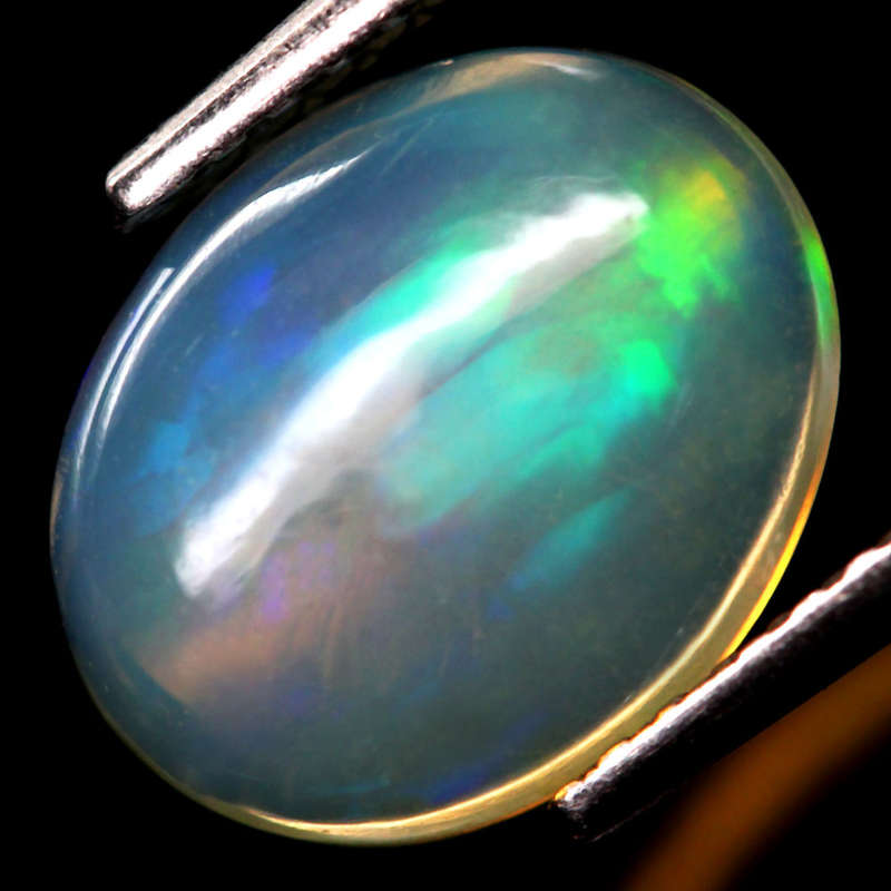 1.57Ct.  Opal Oval Cabochon Multi Colors Glittering Rainbow 3D Ethiopian Gemstone
