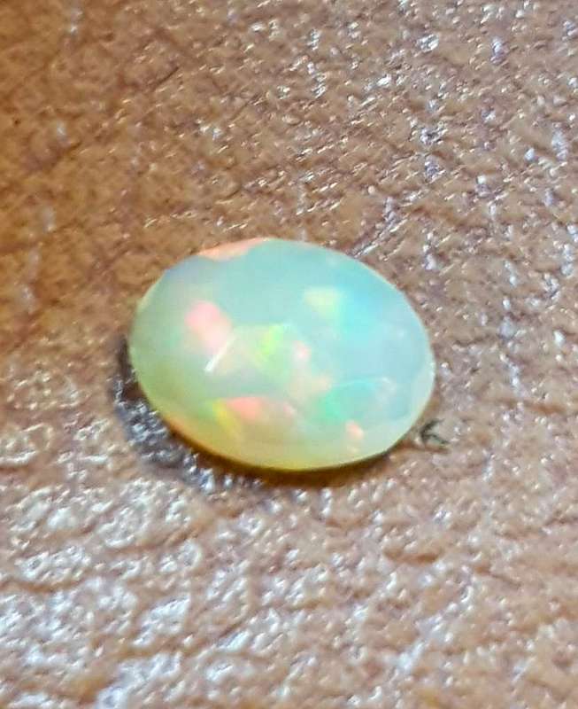 Opal 0.52Cts Oval Facetted 5x7mm Multi Colours Glittering Rainbow 3D! Ethiopian Natural