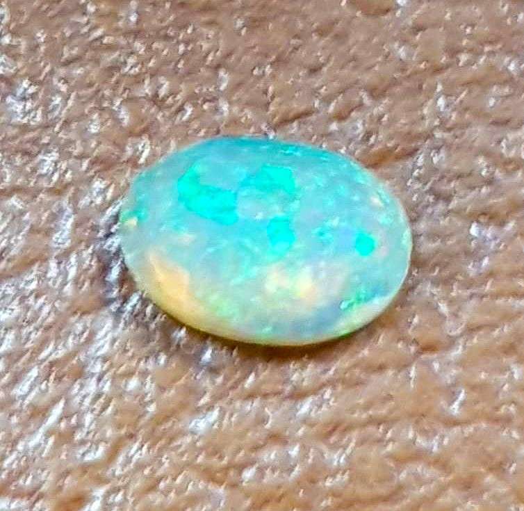 Opal 0.68Cts Oval Facetted 5x7mm Multi Colours Glittering Rainbow 3D! Ethiopian Natural