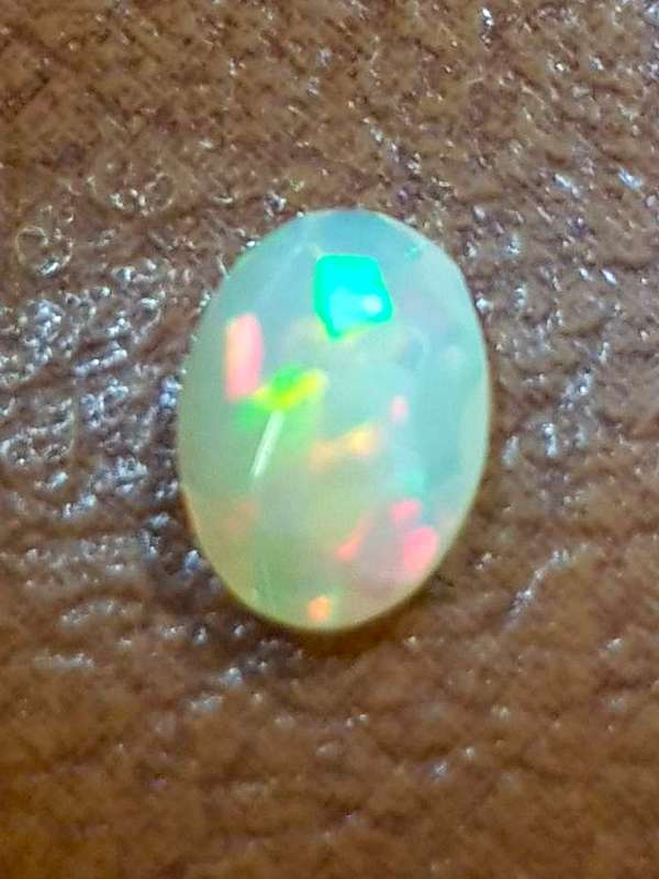 Opal 0.52Cts Oval Facetted 5x7mm Multi Colours Glittering Rainbow 3D! Ethiopian Natural