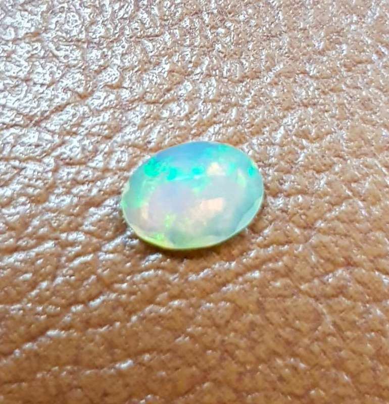 Opal 0.54Cts Oval Facetted 5x7mm Multi Colours Glittering Rainbow 3D! Ethiopian Natural