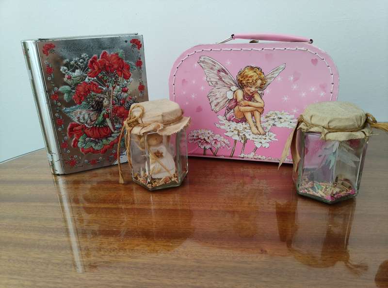 Freshly caught fairies in jars & suitcase