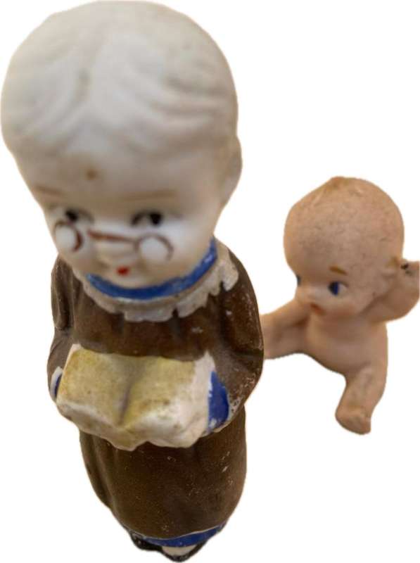 Antique Japan Bisque doll figurine pair kewpie baby and child reading figure