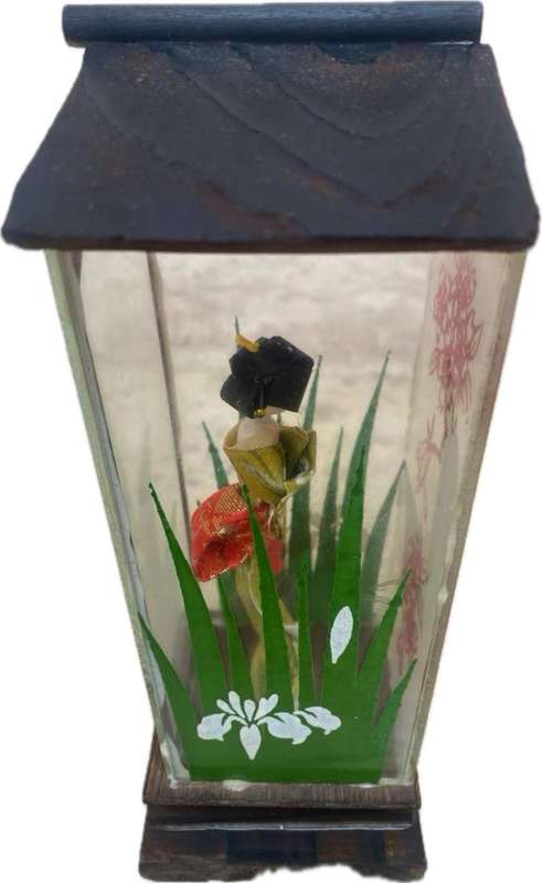 Vintage geisha doll in Perspex glass case with wooden roof