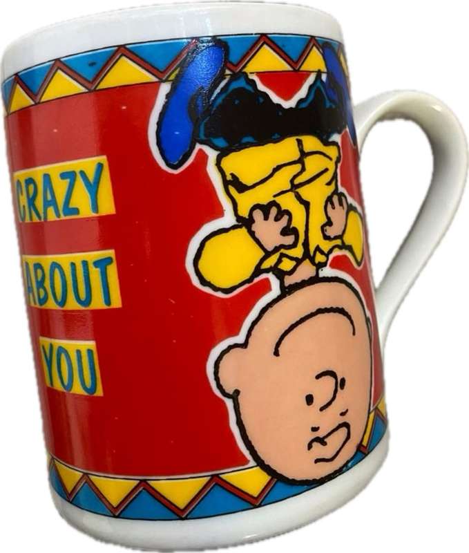Vintage peanuts cartoon coffee mug with pvc Lucy necklace toy