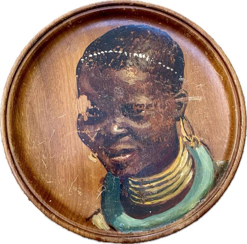 Vintage painted African portrait on wood wall plate tribe person