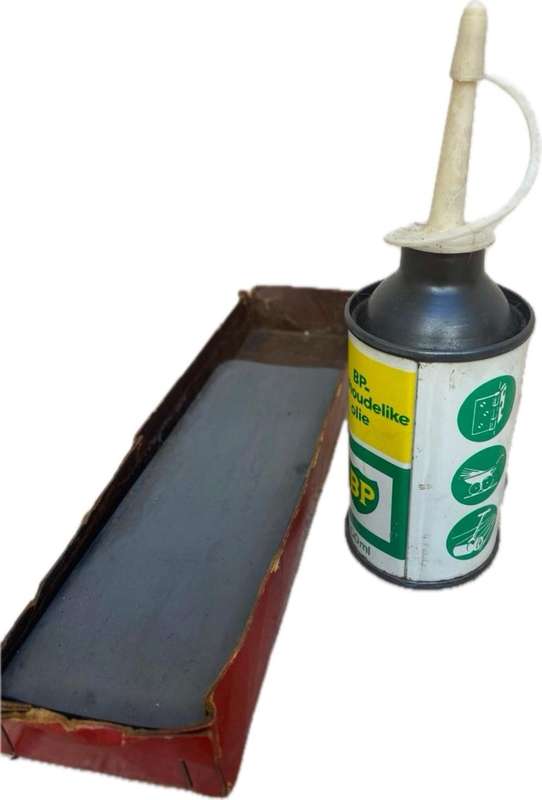 Vintage oil can BP with old sharpening stone
