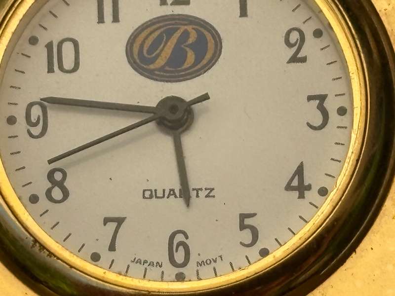 Miniature brass tone quartz cheval mantle clock and B Japan made mantle clock pair