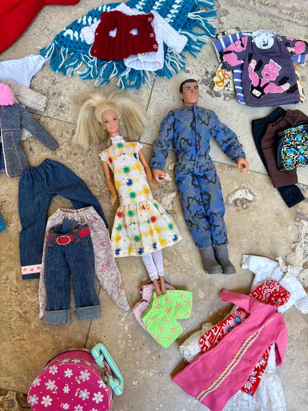 Vintage Barbie and Ken doll pair with extra clothes lot