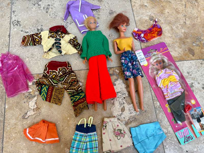 Vintage Barbie doll pair with extra clothes