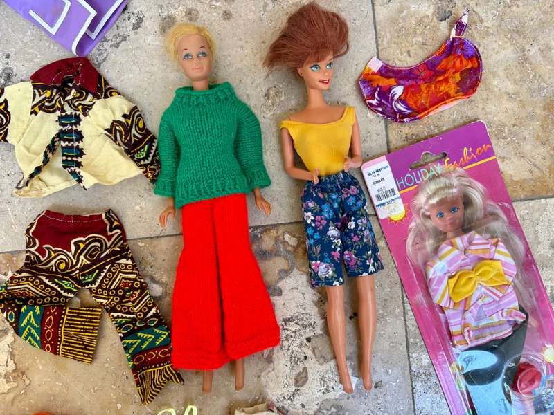 Vintage Barbie doll pair with extra clothes
