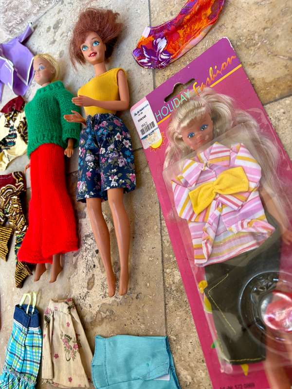 Vintage Barbie doll pair with extra clothes