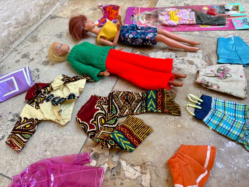 Vintage Barbie doll pair with extra clothes