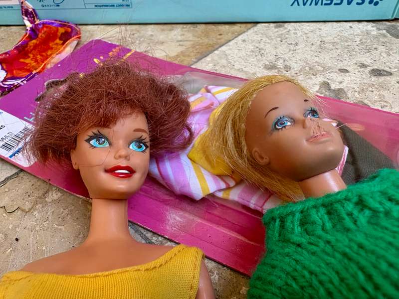 Vintage Barbie doll pair with extra clothes