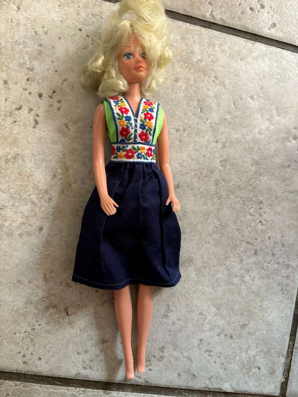 Vintage Barbie doll pair with extra clothes